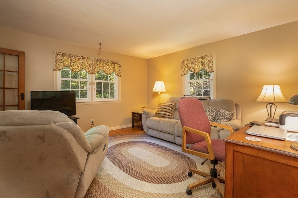 231 Munn Road Monson, MA 01057 - Photo 19 of 38 a living room with furniture a fireplace and a large window