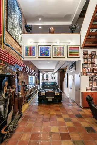 a living room with lots of furniture and a rug