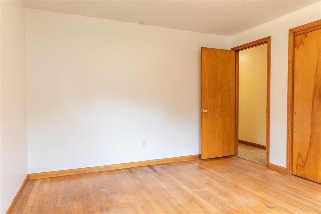59 Mountain Road Holyoke, MA 01040 - Photo 24 of 40 a view of an empty room with wooden floor