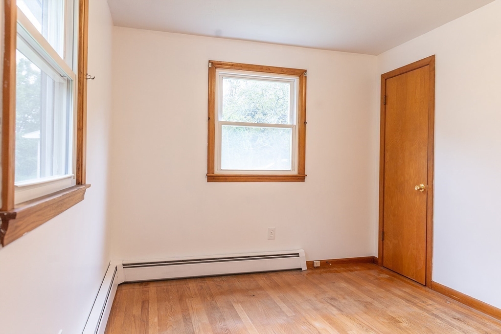 59 Mountain Road Holyoke, MA 01040 - Photo 25 of 40 an empty room with wooden floor and windows