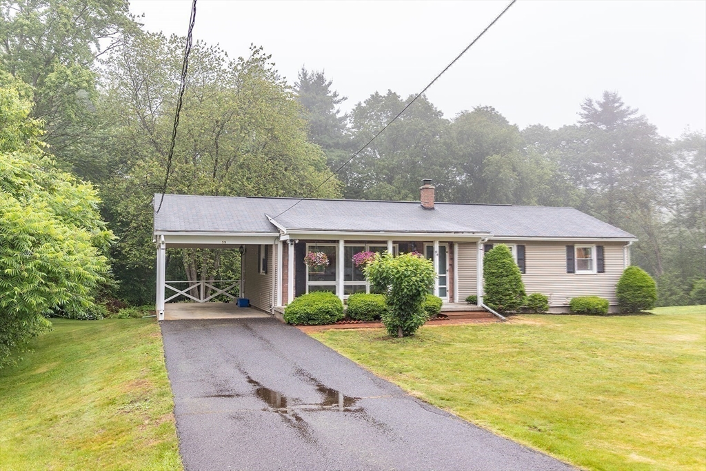 59 Mountain Road Holyoke, MA 01040 - Photo 38 of 40 a front view of a house with a yard and trees