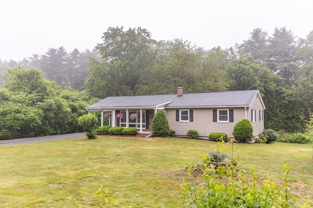 59 Mountain Road Holyoke, MA 01040 - Photo 40 of 40 a view of house that has a lot of plants and large trees
