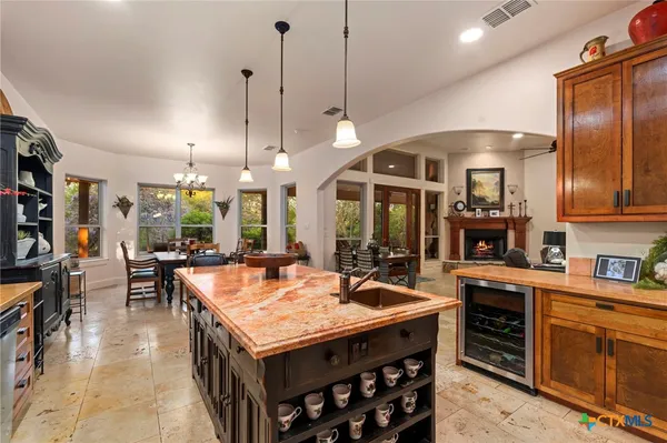 a open kitchen with stainless steel appliances granite countertop a stove and refrigerator