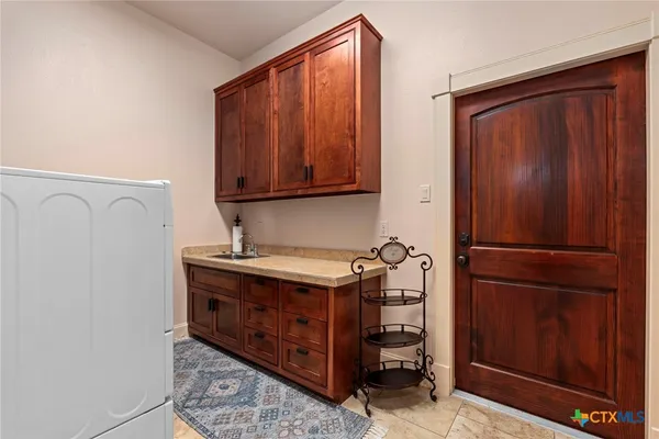 a room with a refrigerator and a stove