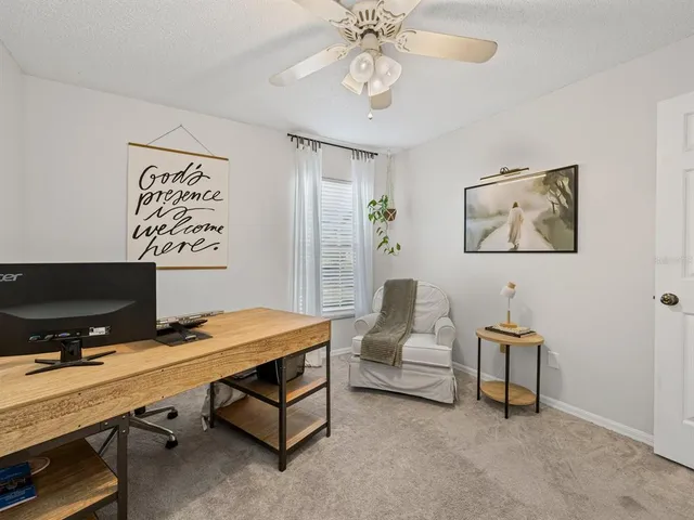 a bedroom with a workspace