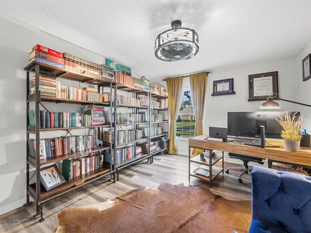 a workspace with a bookshelf and a workspace