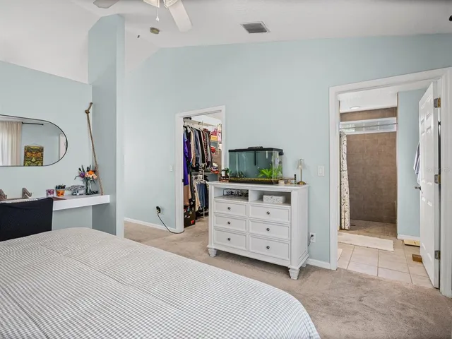 a room with a bed and a dresser