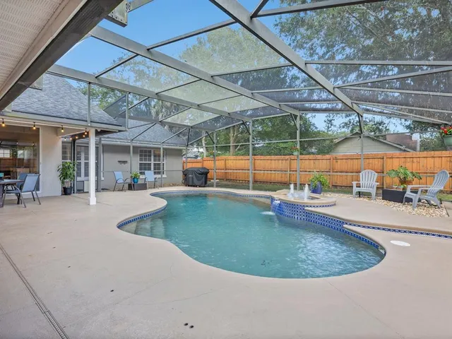 a view of a swimming pool with a patio