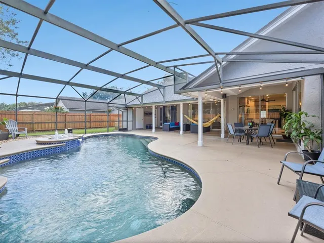 a view of a swimming pool with a patio