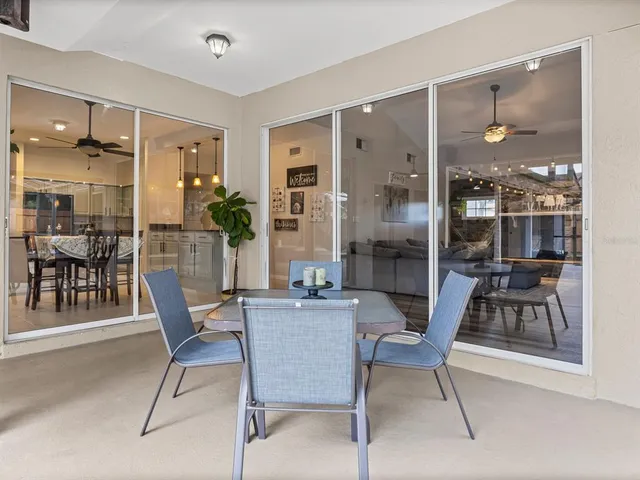 a dining room with furniture and wooden floor