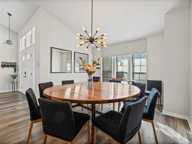a dining room with furniture and window