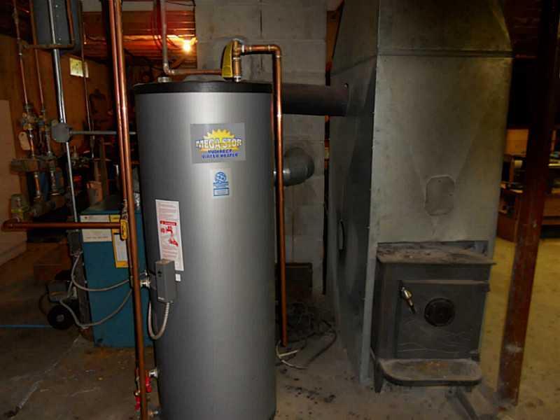 1072 East Ridge Road Cornville, ME 04976 - Photo 22 of 29 Basement. Heating system and water...
