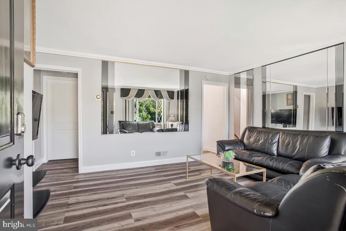 4004 Dudley Avenue Baltimore, MD 21213 - Photo 13 of 36 a living room with furniture and a large window