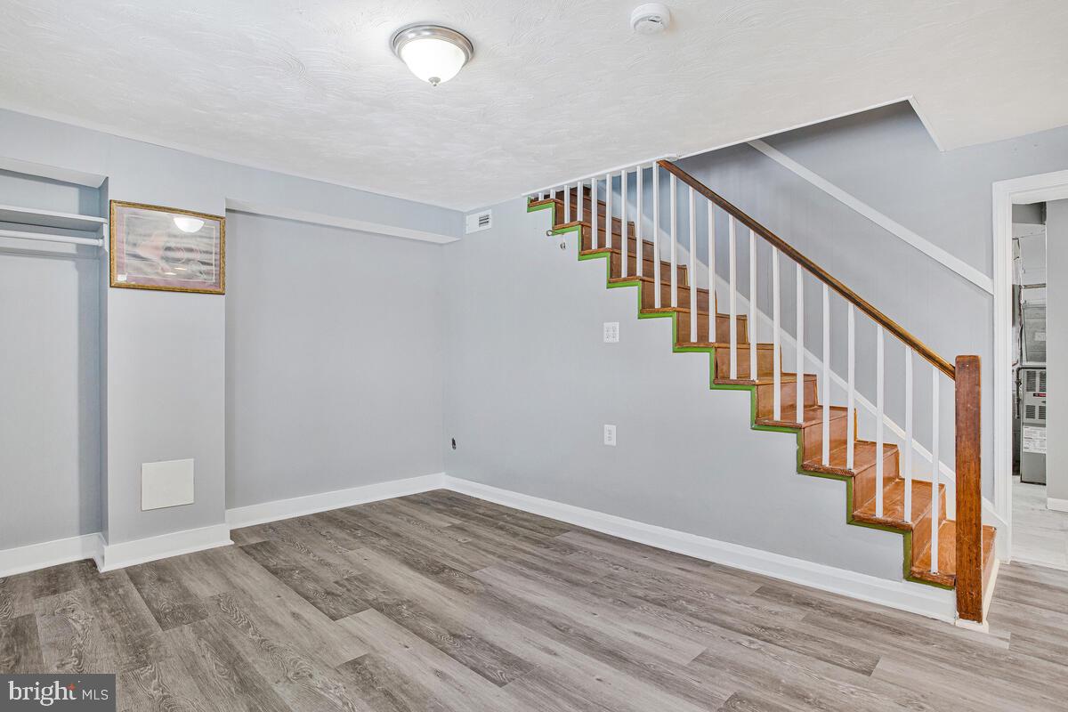 4004 Dudley Avenue Baltimore, MD 21213 - Photo 17 of 36 a view of an entryway with wooden floor
