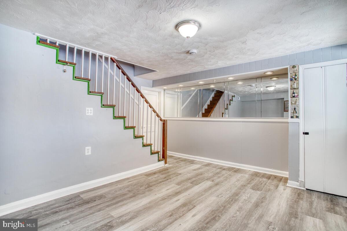 4004 Dudley Avenue Baltimore, MD 21213 - Photo 19 of 36 a view of entryway with wooden floor