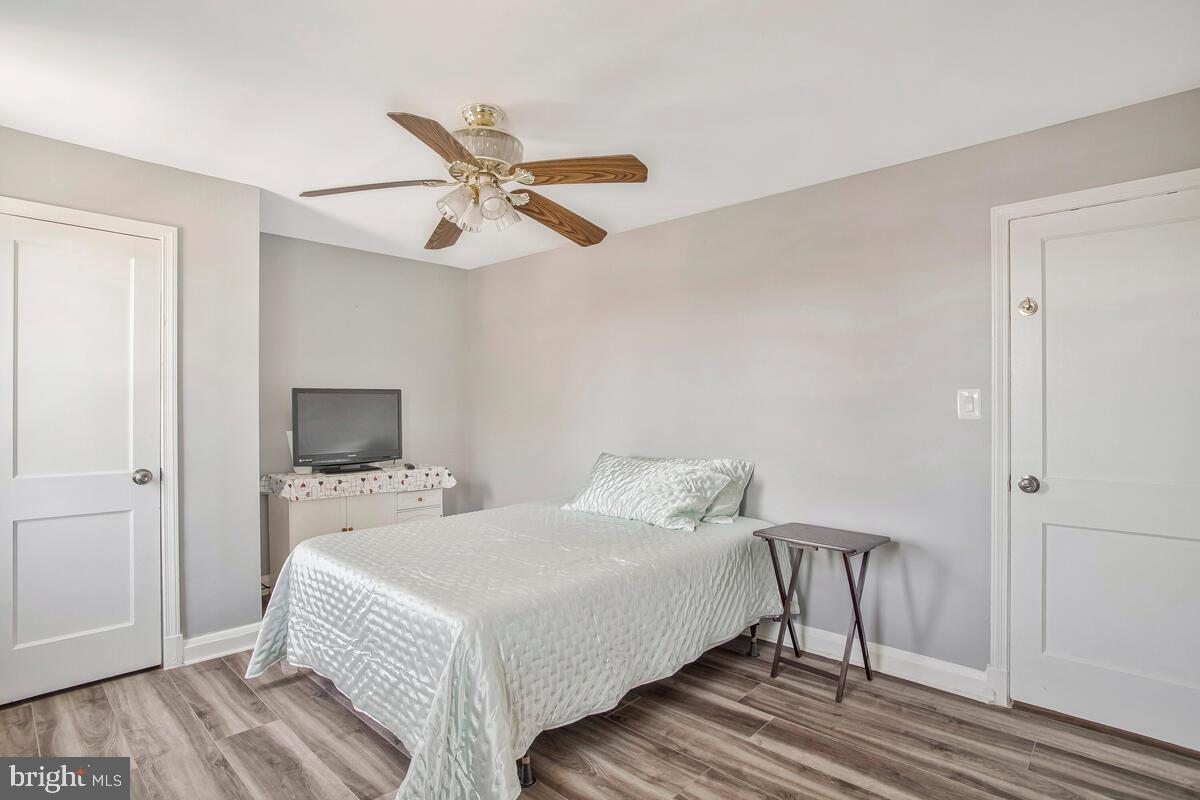4004 Dudley Avenue Baltimore, MD 21213 - Photo 26 of 36 a bedroom with a bed and a flat screen tv