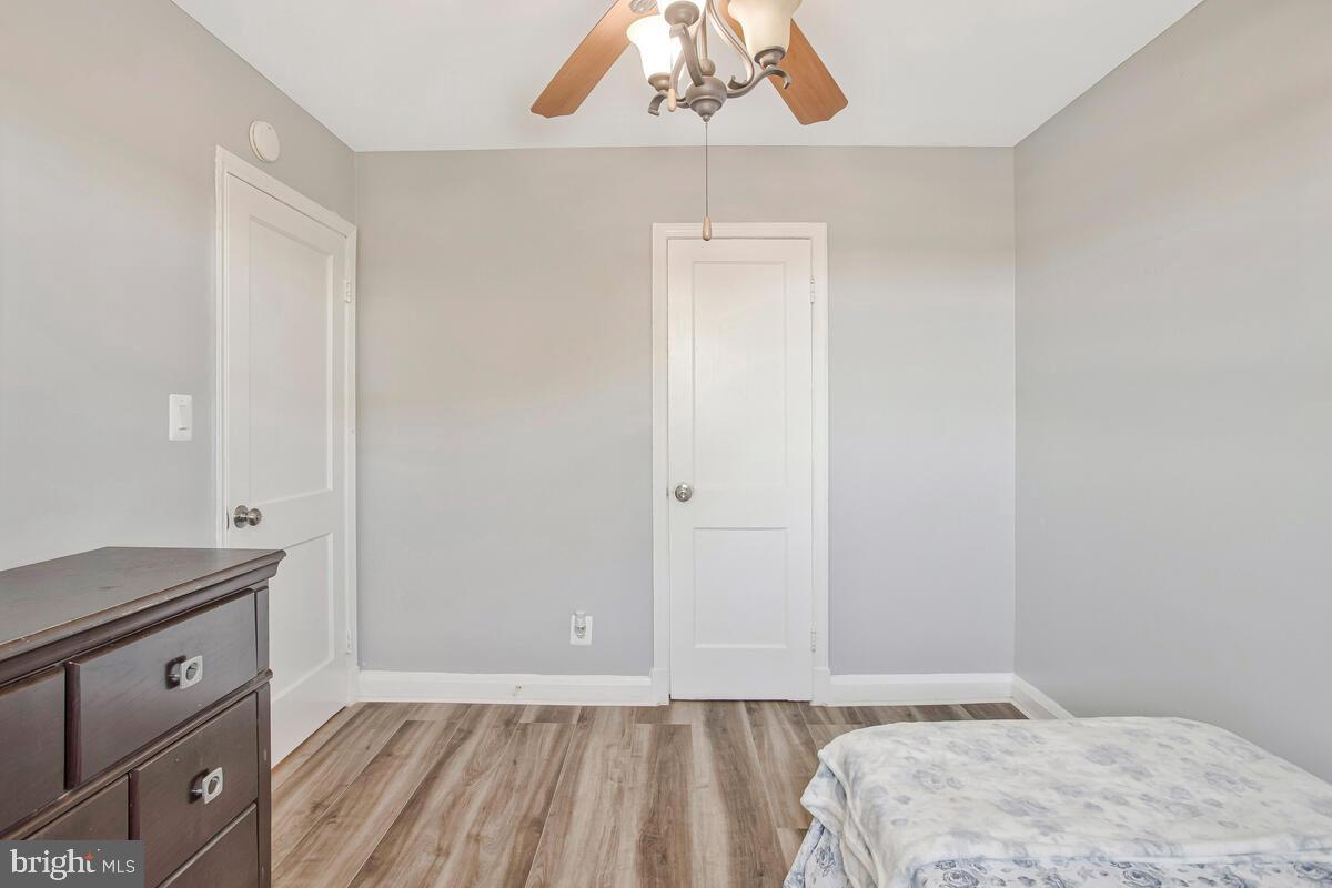4004 Dudley Avenue Baltimore, MD 21213 - Photo 27 of 36 a bedroom with a bed and a dresser in it
