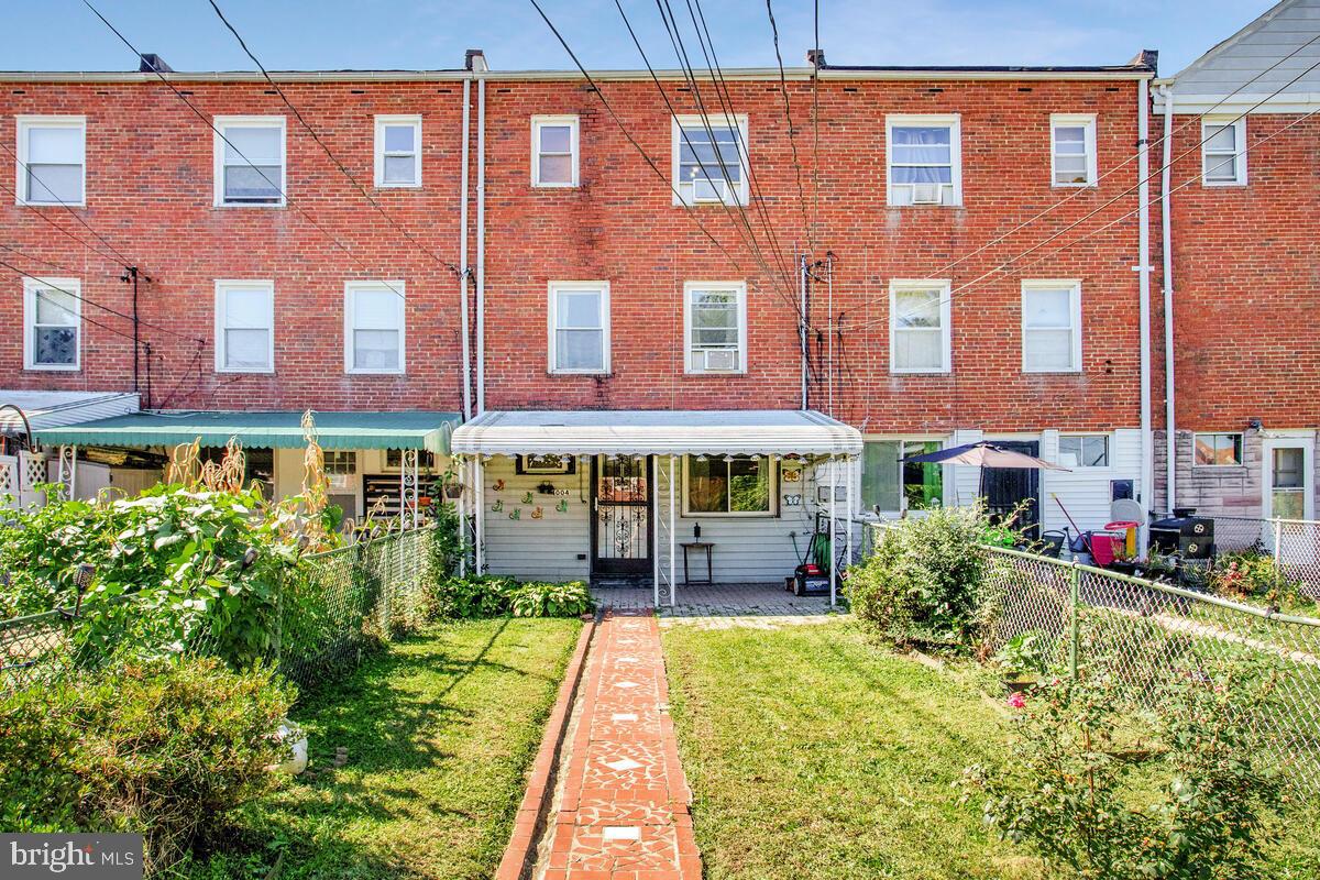 4004 Dudley Avenue Baltimore, MD 21213 - Photo 34 of 36 a view of a building with a garden