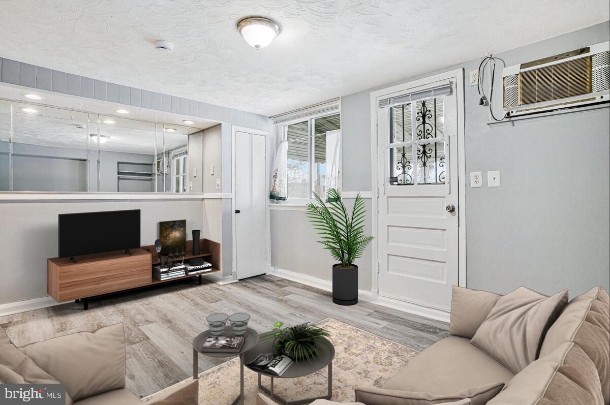 4004 Dudley Avenue Baltimore, MD 21213 - Photo 5 of 36 a living room with furniture and a flat screen tv
