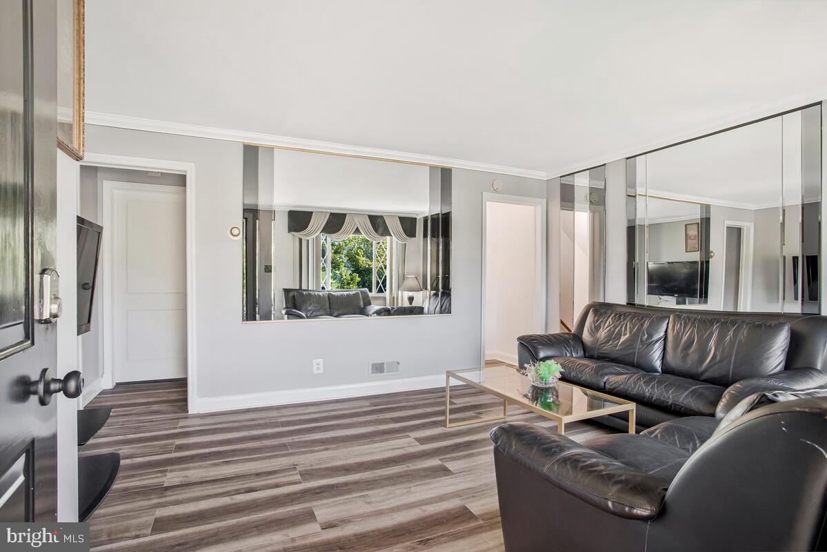 4004 Dudley Avenue Baltimore, MD 21213 - Photo 9 of 36 a living room with furniture and a large window
