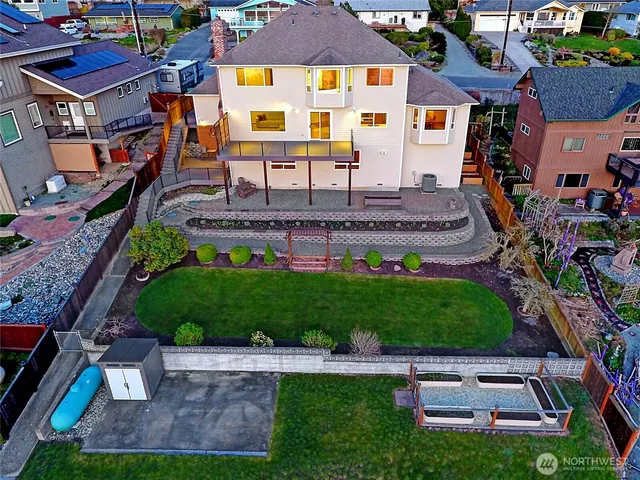a aerial view of a house with a yard