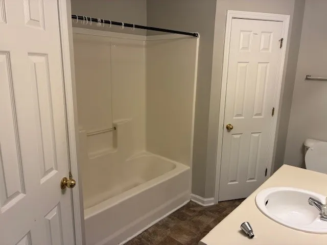 a bathroom with a sink and a shower curtain