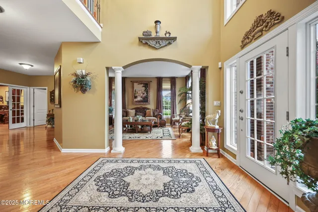 a view of a dining room with furniture wooden floor and chandelier