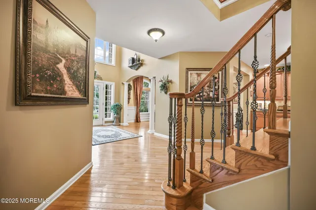 a living room with furniture a couch and a chandelier