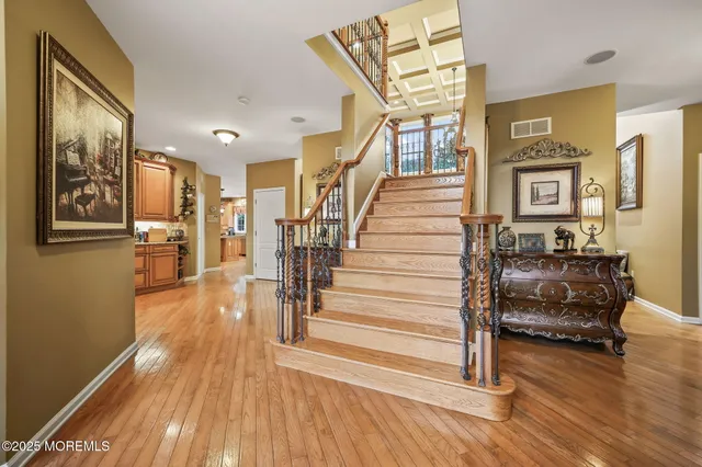 a bathroom with a sink mirror vanity and toilet