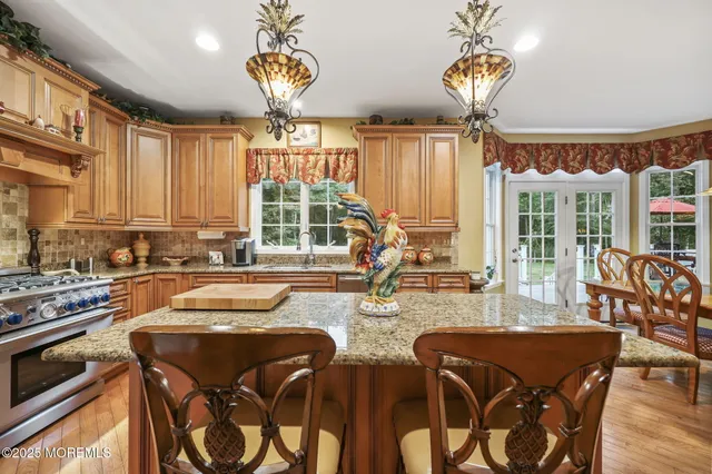 a bed sitting in a spacious bedroom next to a window