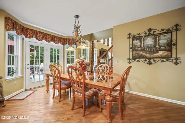 a spacious bathroom with a sink a mirror and a shower
