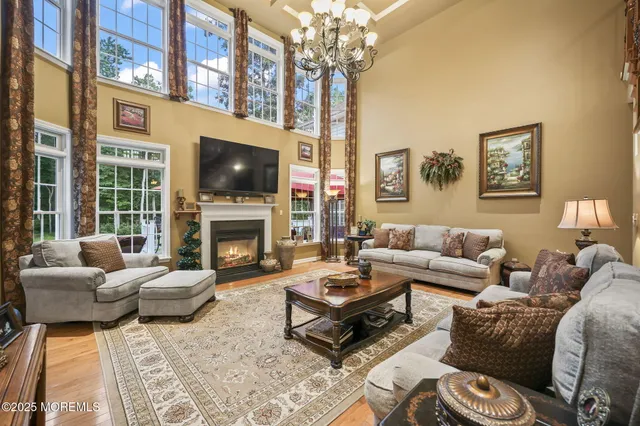 a bed room with a bed and a chandelier