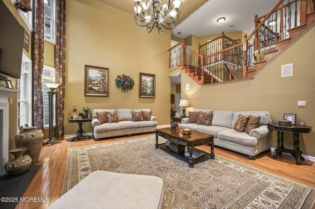 a bathroom with a granite countertop toilet sink and mirror