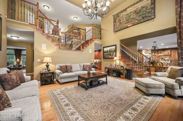 a view of a house with a yard and potted plants
