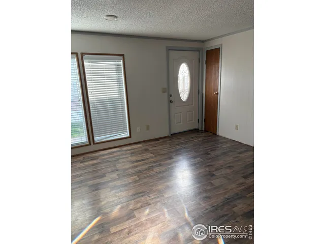 a view of a livingroom with wooden floor