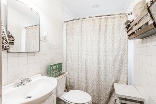 3105 Academy Road Portland, TN 37148 - Photo 11 of 17 a bathroom with a sink a toilet and a mirror