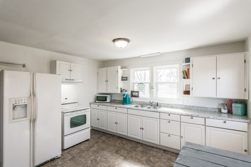 3105 Academy Road Portland, TN 37148 - Photo 8 of 17 a kitchen with white cabinets and white appliances