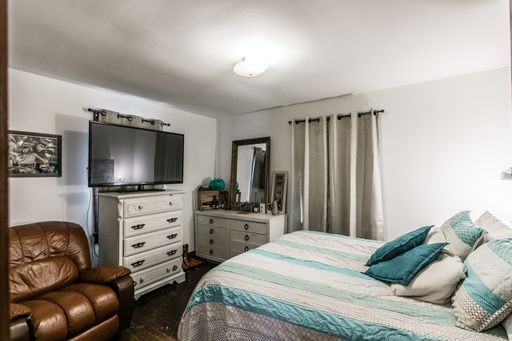 3105 Academy Road Portland, TN 37148 - Photo 9 of 17 a bedroom with a bed and flat screen tv