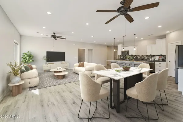 a large kitchen with kitchen island a sink stainless steel appliances and cabinets