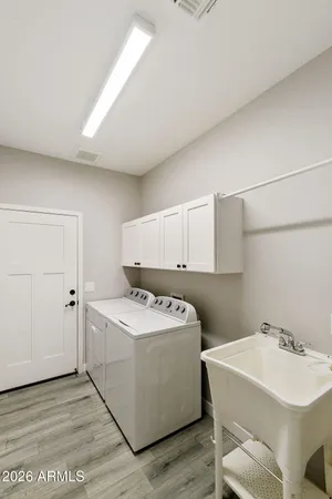 a view of a kitchen with a sink and a stove top oven