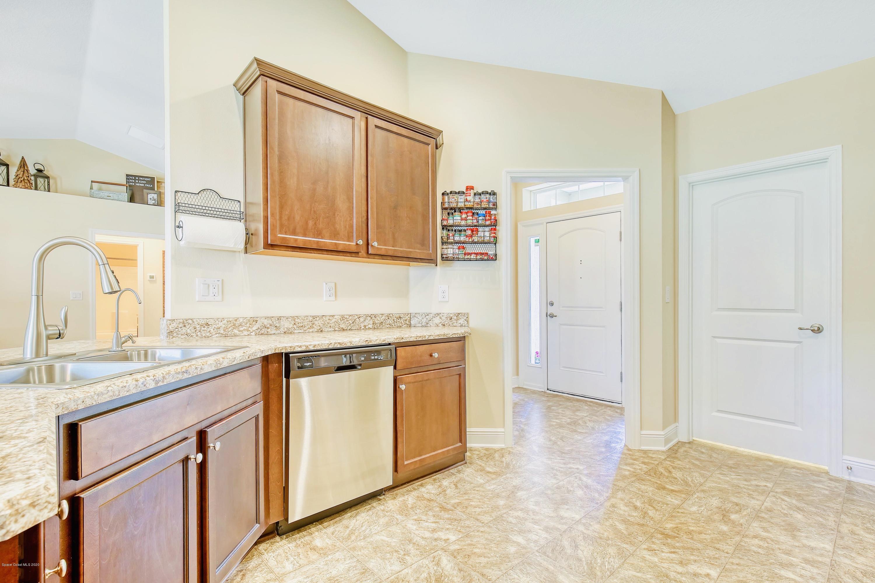 919 Thompson Road Southwest Palm Bay, FL 32908 - Photo 13 of 38 a bathroom with a granite countertop sink and a mirror