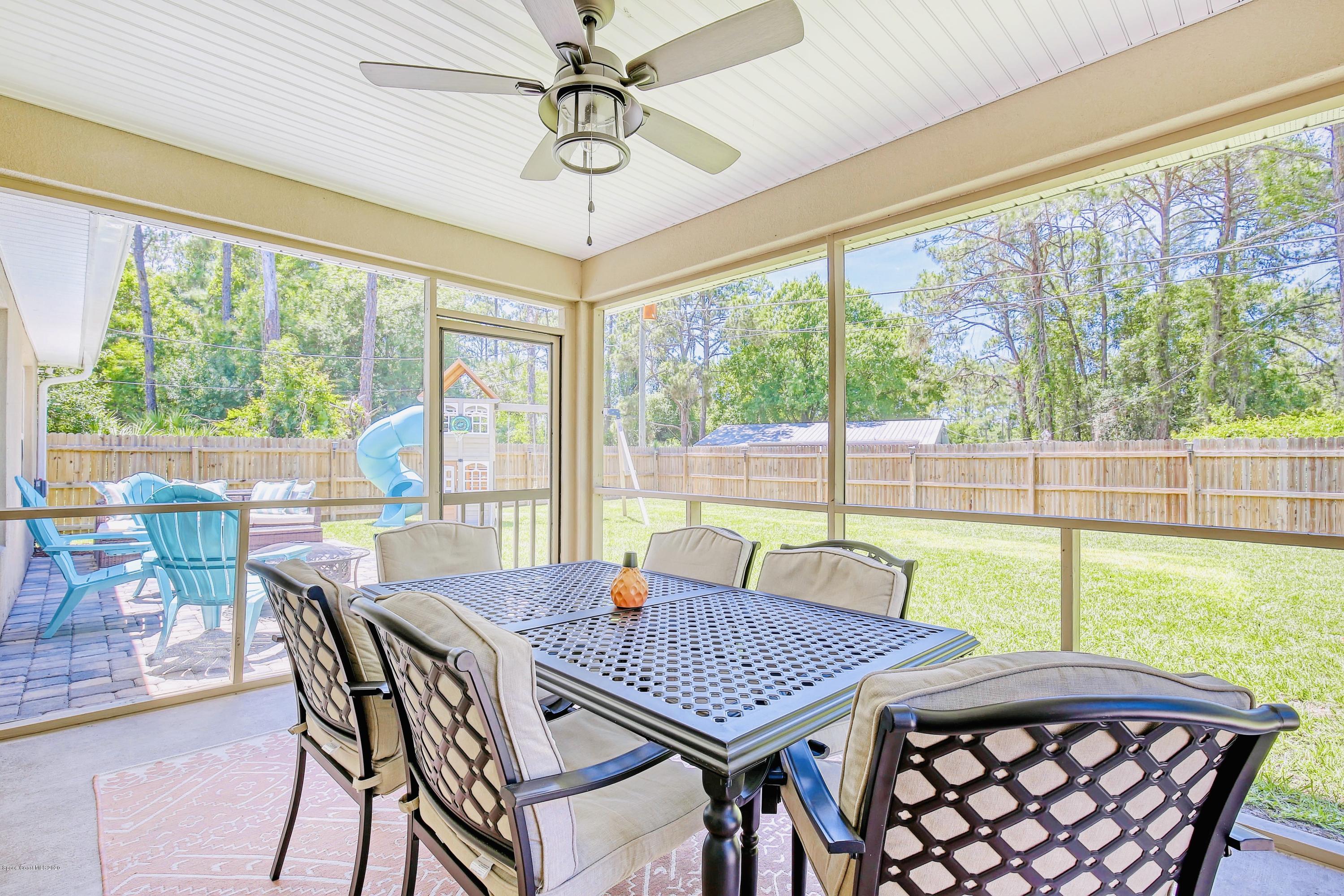 919 Thompson Road Southwest Palm Bay, FL 32908 - Photo 27 of 38 a view of a dining room with furniture window and outside view