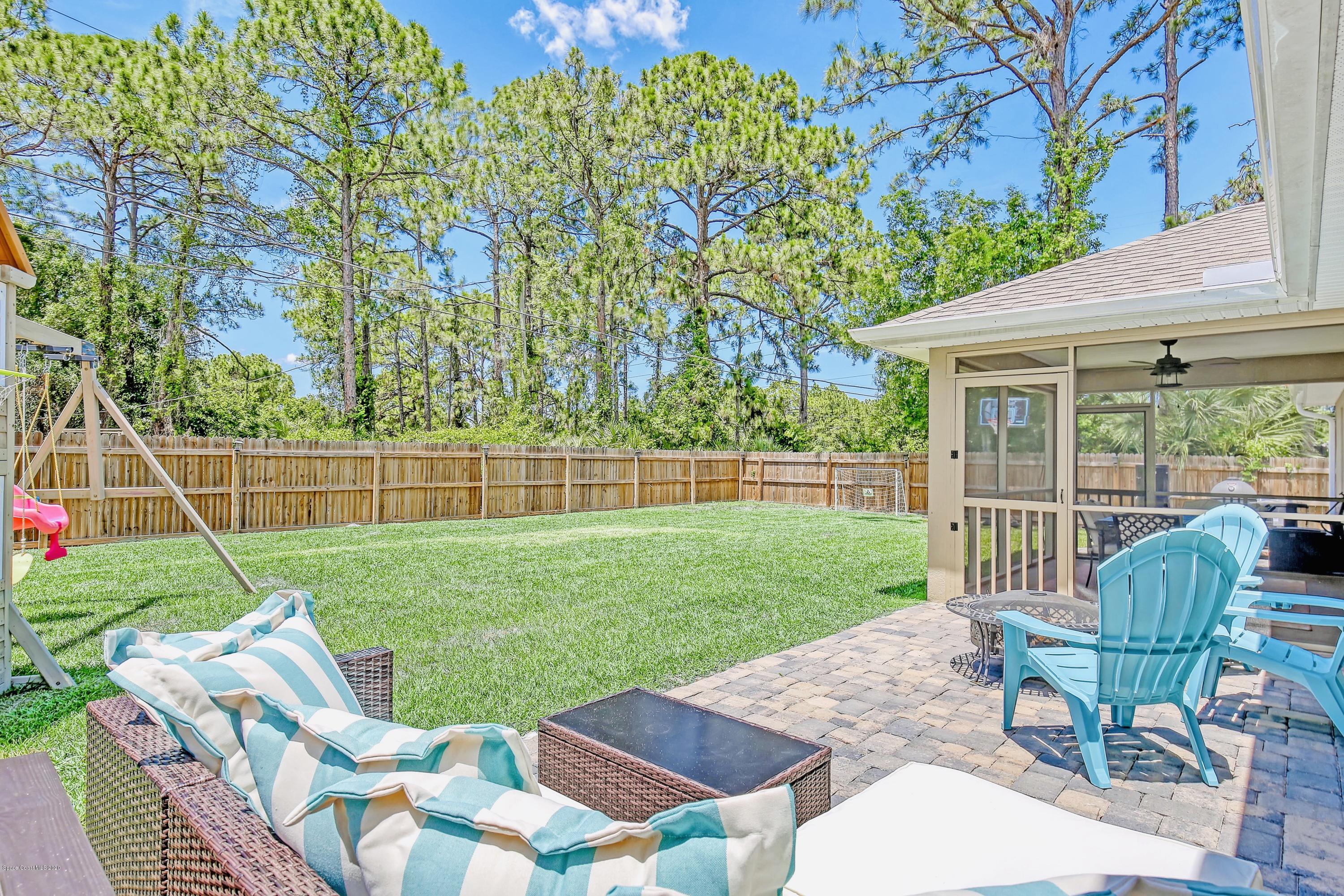 919 Thompson Road Southwest Palm Bay, FL 32908 - Photo 28 of 38 a view of a yard with a porch