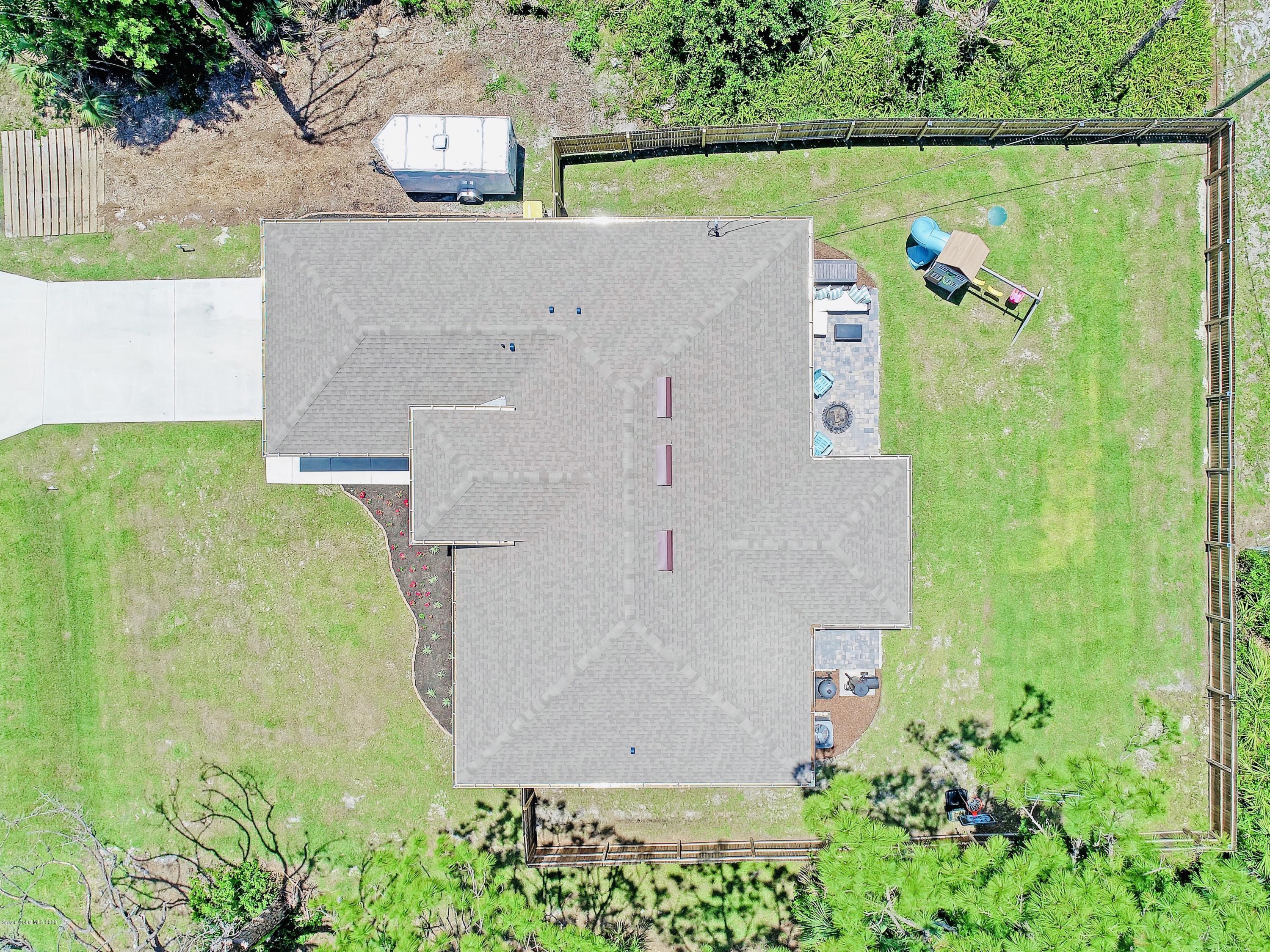 919 Thompson Road Southwest Palm Bay, FL 32908 - Photo 37 of 38 an aerial view of a house with pool