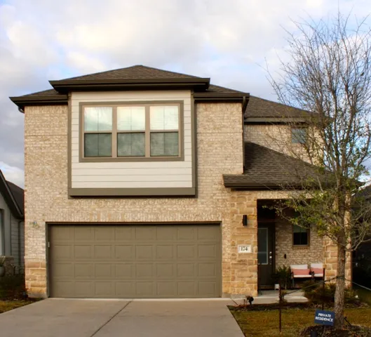 a front view of a house with a outdoor space