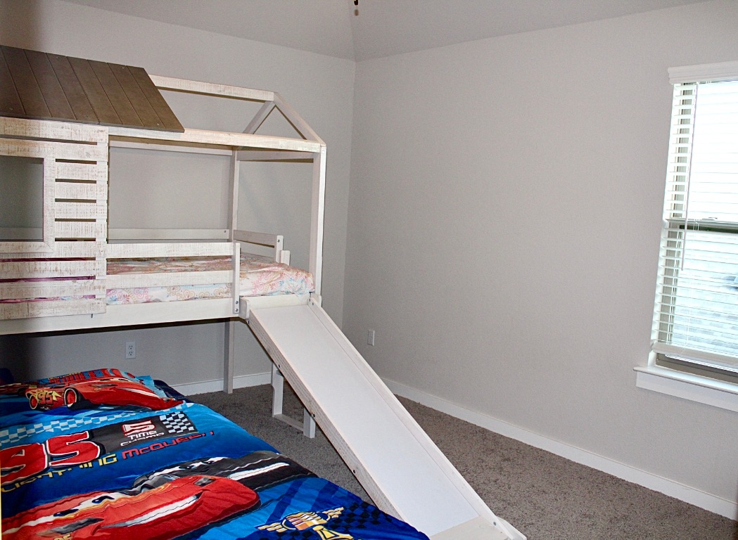 174 Gullivers Drive Elgin, TX 78621 - Photo 16 of 28 a storage room with cabinets