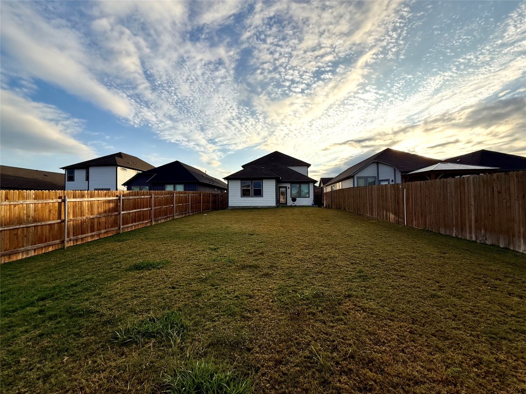 174 Gullivers Drive Elgin, TX 78621 - Photo 20 of 28 a house view with a garden space
