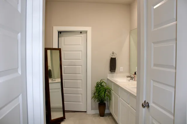 a bathroom with a shower and a sink