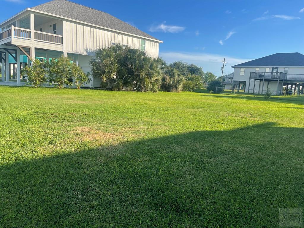 971 Surfview Crystal Beach, TX 77650 - Photo 3 of 4 a view of a house with a big yard