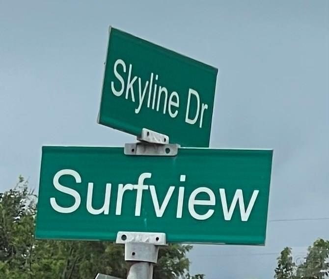 971 Surfview Crystal Beach, TX 77650 - Photo 4 of 4 a sign that is on a wooden wall